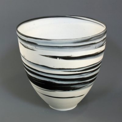 Large white on black agateware beaker 1