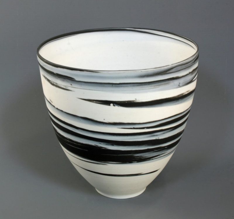 Large white on black agateware beaker 1