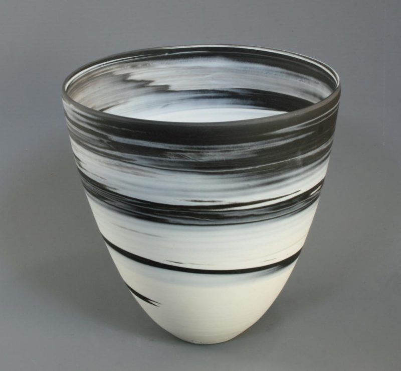 Large white on black agateware beaker 2