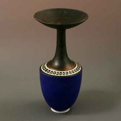 Small midnight blue bottle with bronze top