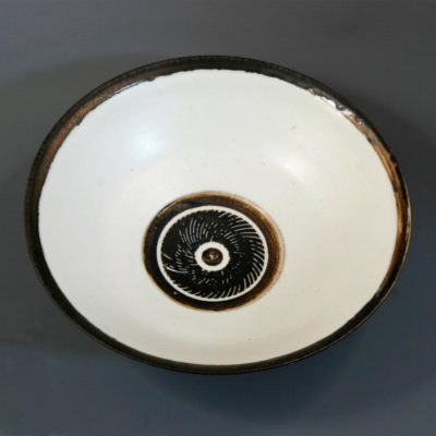 Small white bowl with bronzed rim and sgraffito centre